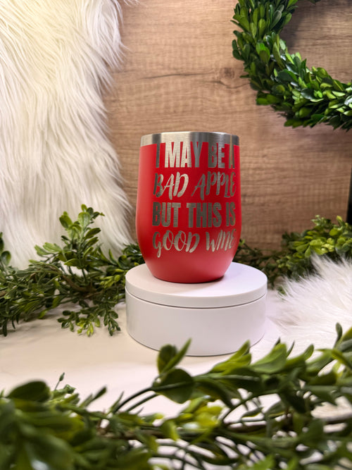 Red wine tumbler with text ' I may be a bad apple but this is good wine' and poison apple on other side