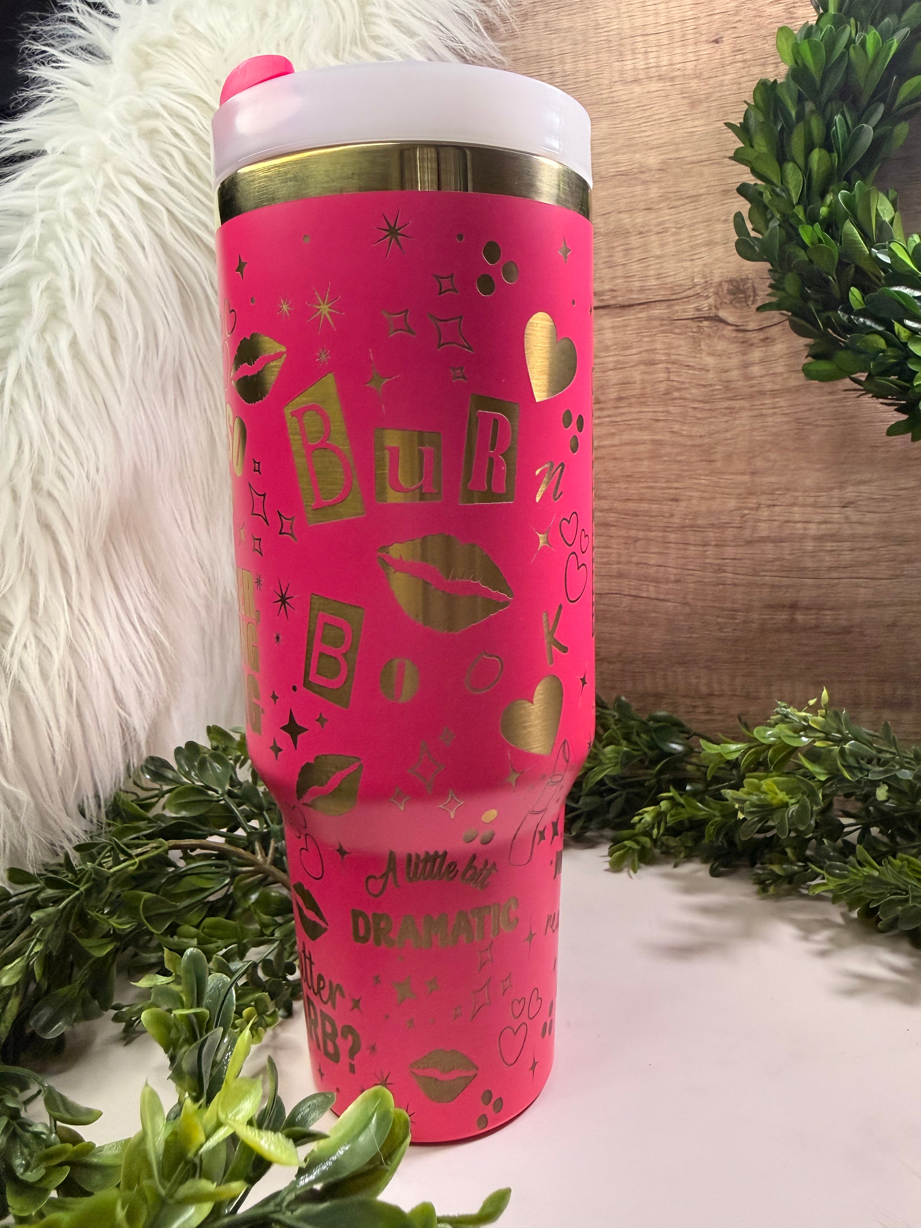 Pink tumbler with burn book, kiss lips, hearts, and mean girl quotes