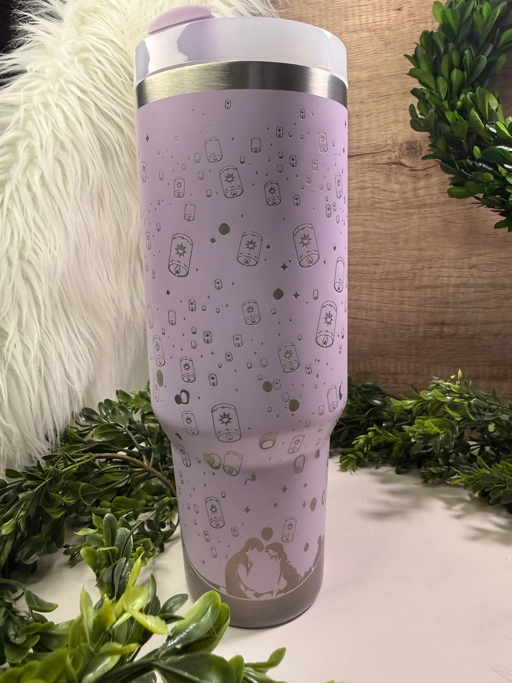 Purple tumbler with rapunzel in boat and floating lanterns