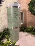 Mint green travel mug with text and graphics Toy Story alien the claw