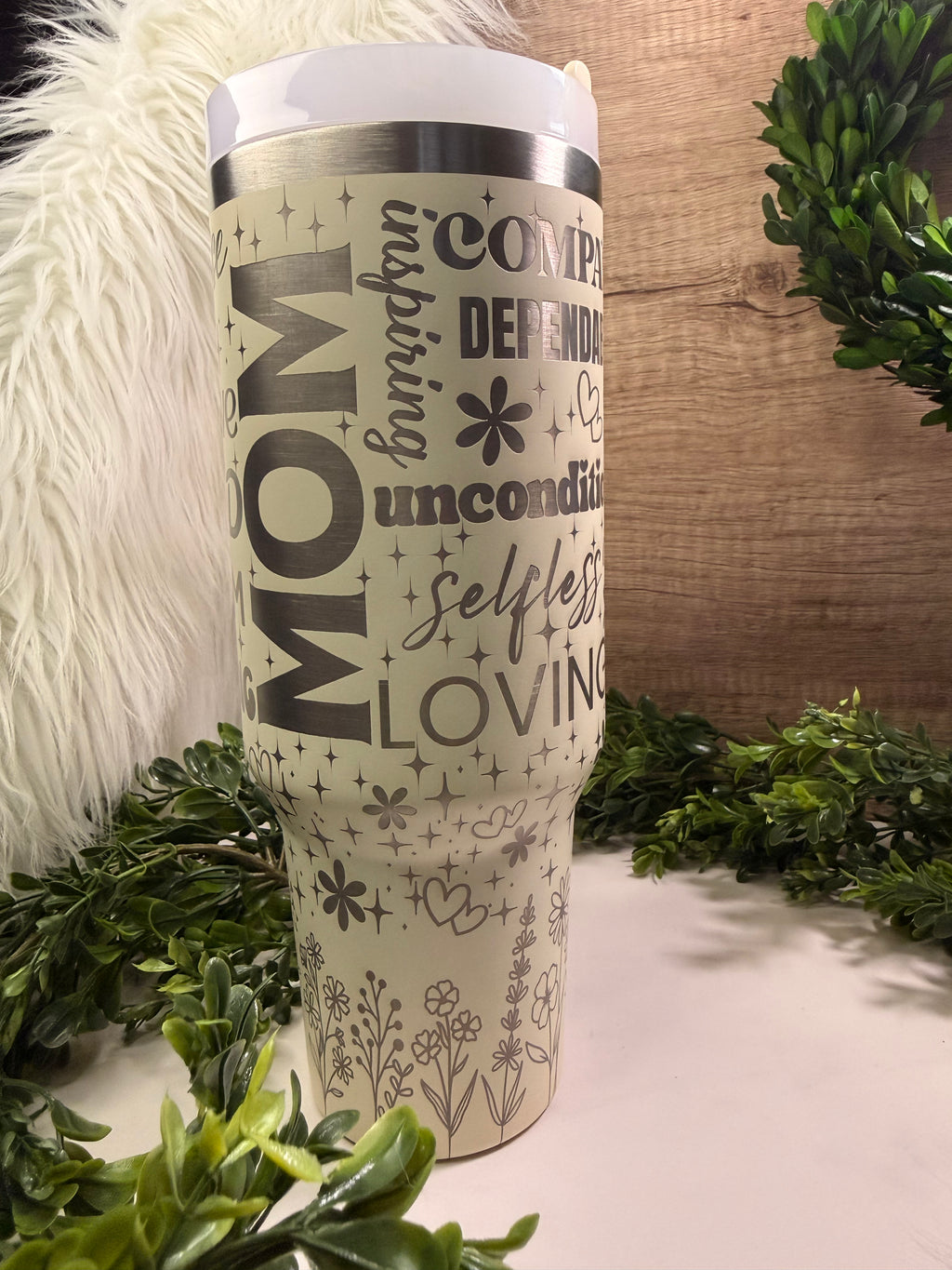 Tumbler with 'Mom' and various words printed on it positive words to mom with flowers and hearts and stars