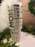 Tumbler with 'Mom' and various words printed on it positive words to mom with flowers and hearts and stars
