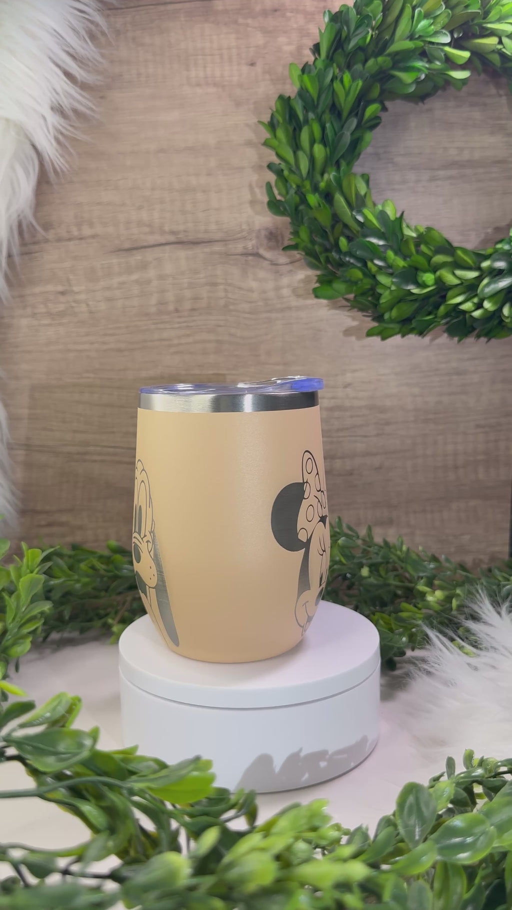 Peach wine tumbler engraved with cartoon character faces design